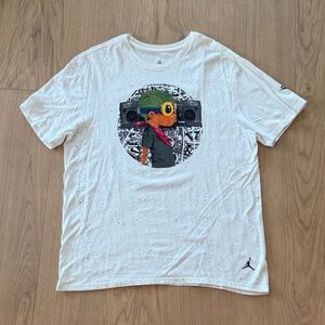 Jordan x Hebru Brantley White Short Sleeve Tee with Flyboy Graphic. Melo XL